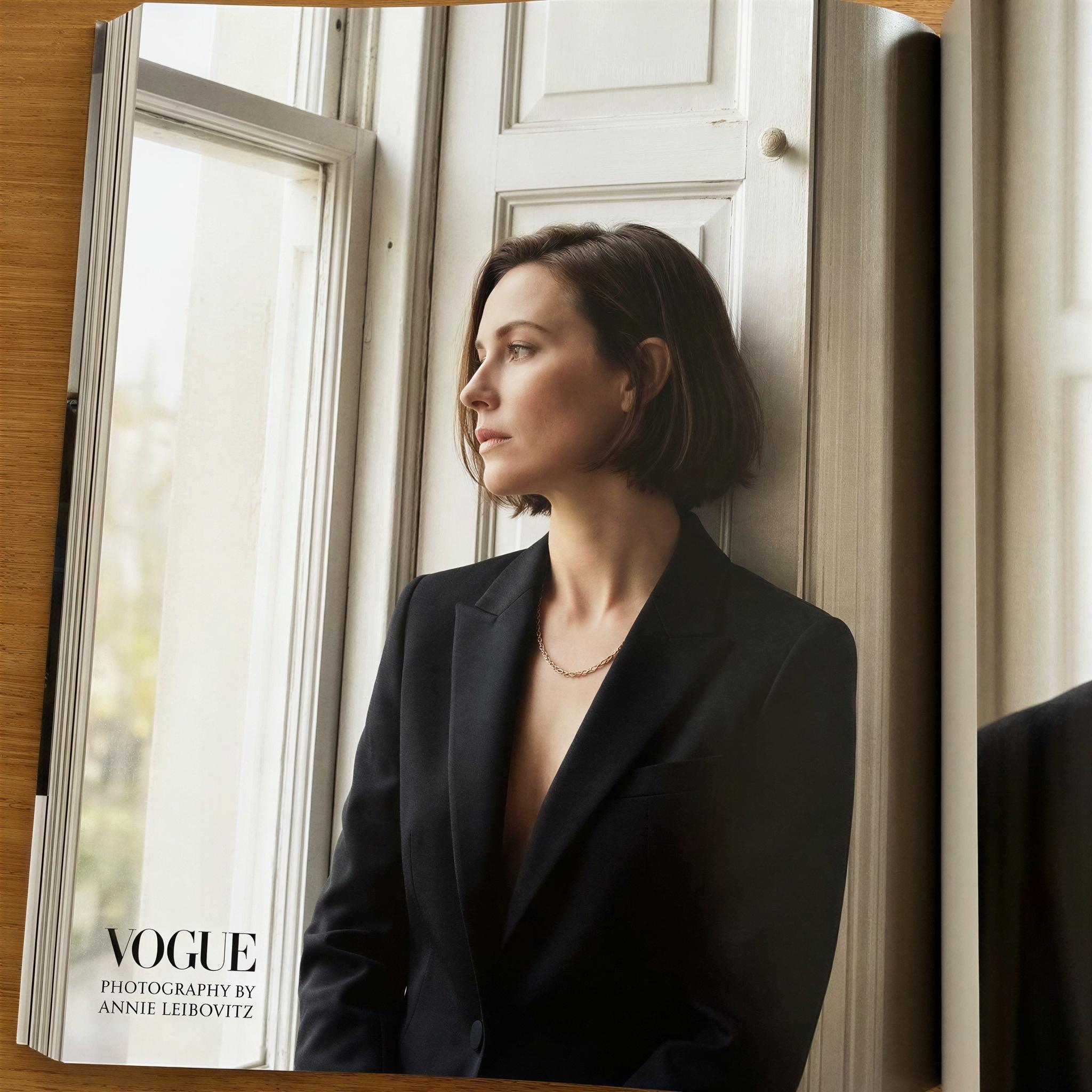 Vogue editorial style solo photography, bright soft window light highlighting profile, high-contrast intimate mood, single subject leaning against a classic white window frame, elegant composure, sharp focus, magazine quality natural light portraiture, emphasizing clear features