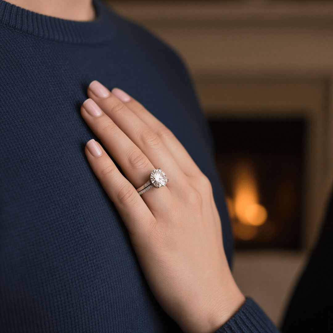 Extreme close-up of an engagement ring on a woman's hand resting on her partner's chest, soft romantic lighting.